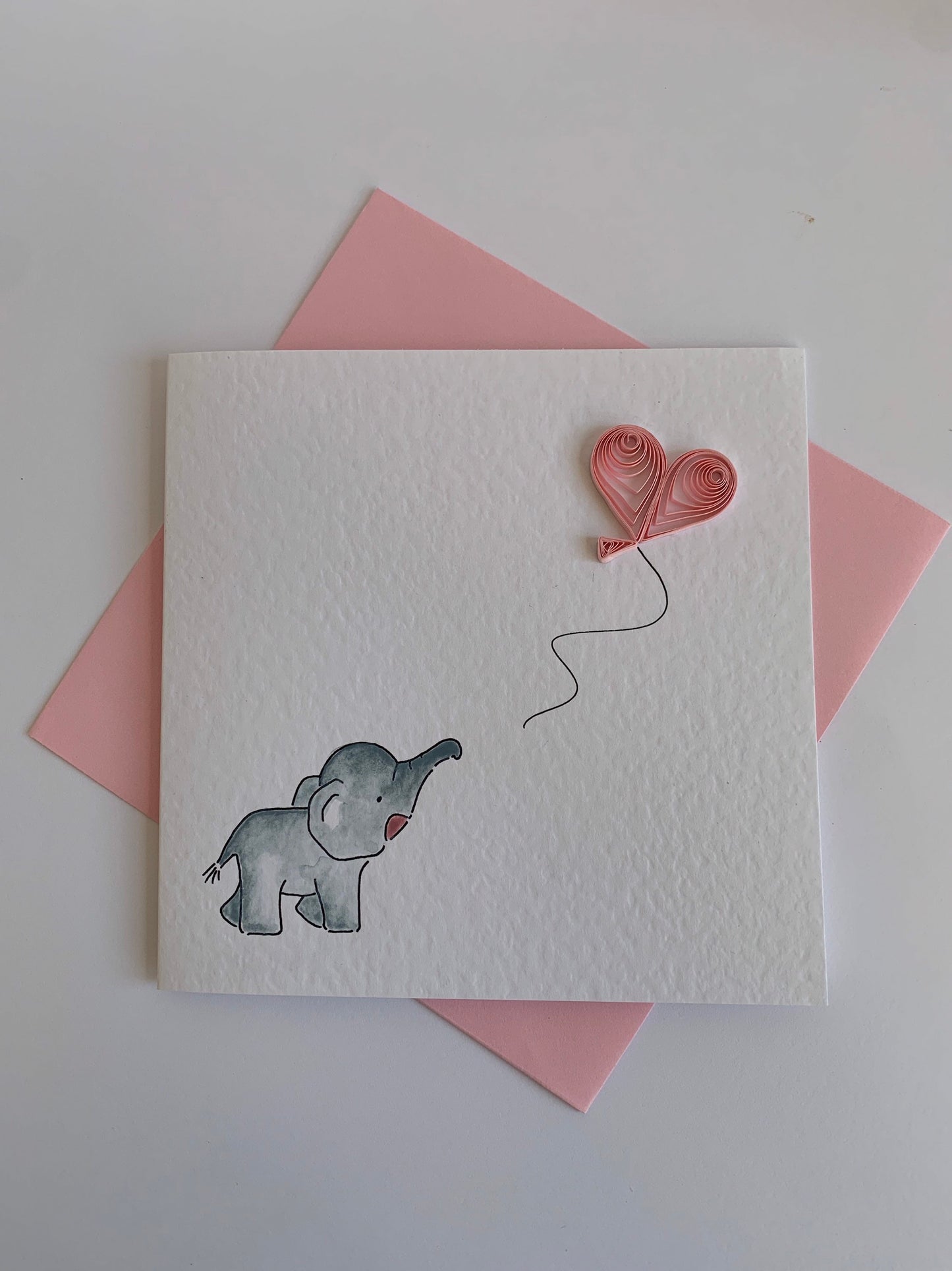 Elephant and Blue Heart Balloon
