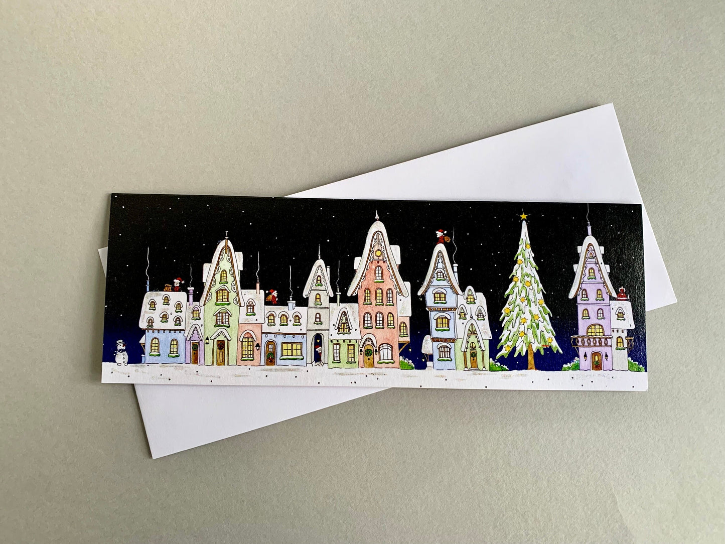 Snowy Houses on Christmas Night