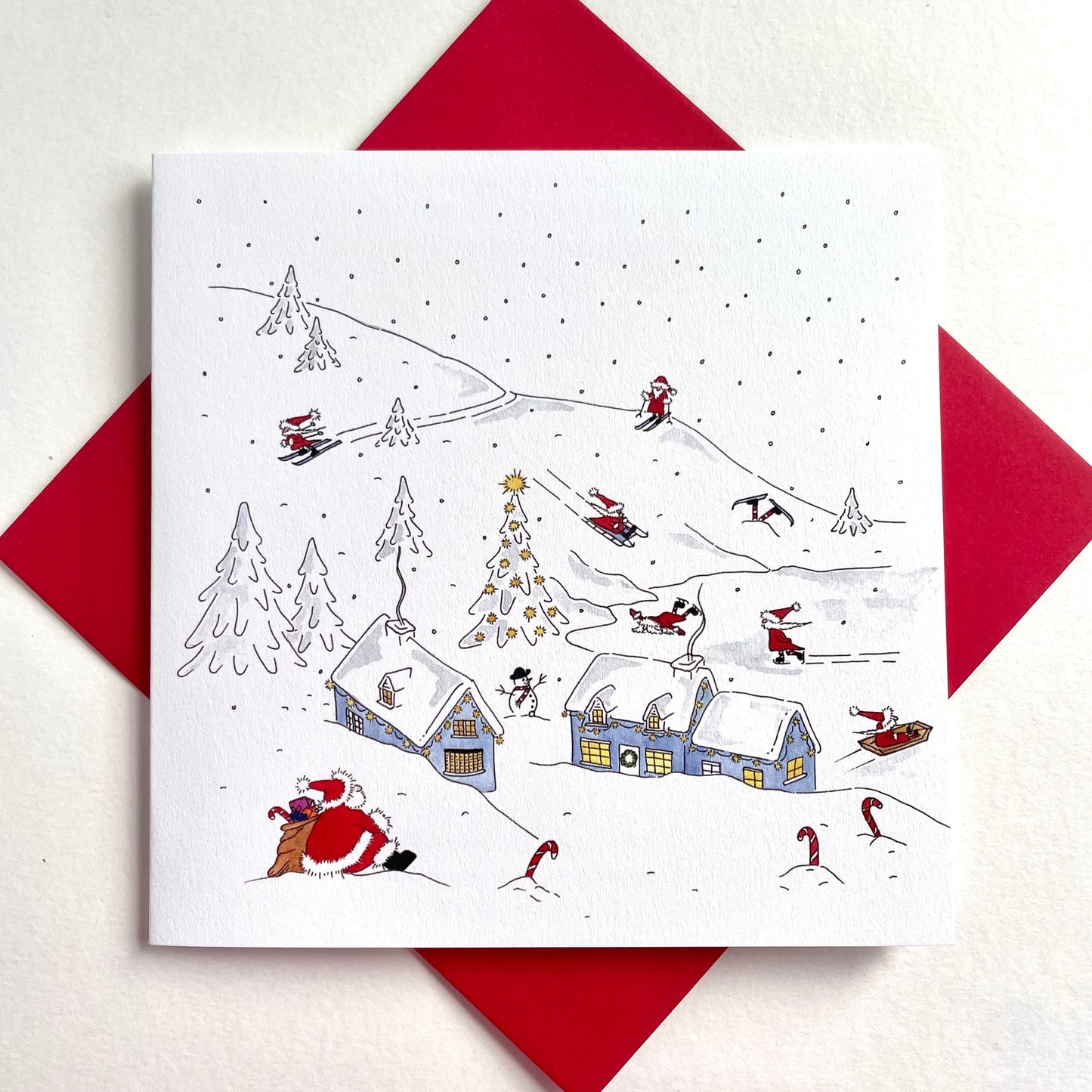 Father Christmas Charity Christmas Cards – Skiing Santas in a Snowy Village – Original Watercolour – Pack of 5