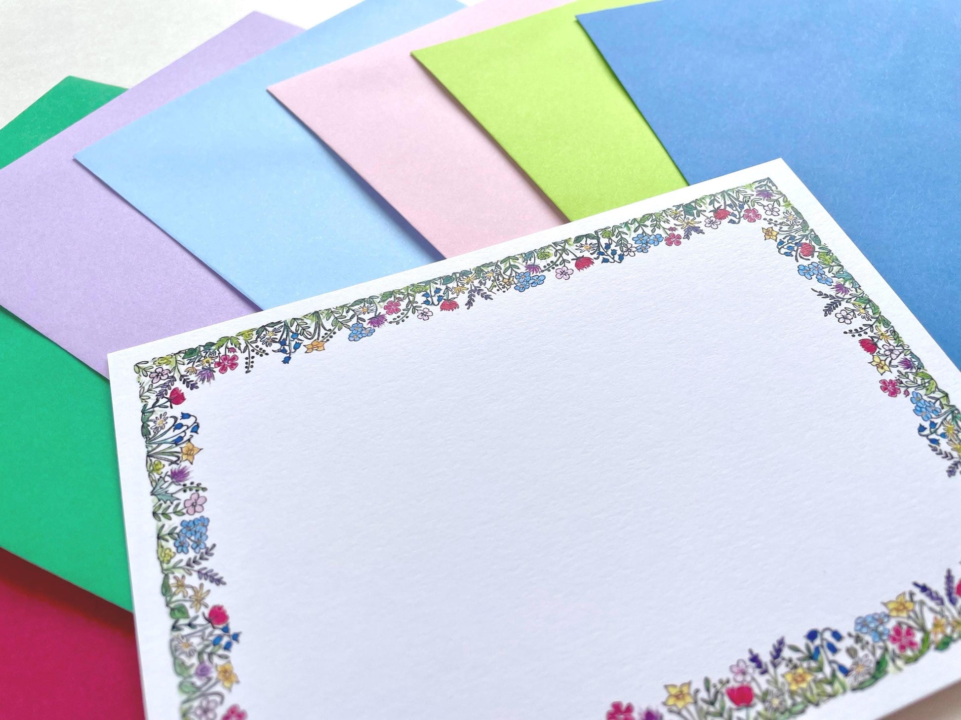     Pack of blank watercolour flower note cards with assorted coloured envelopes