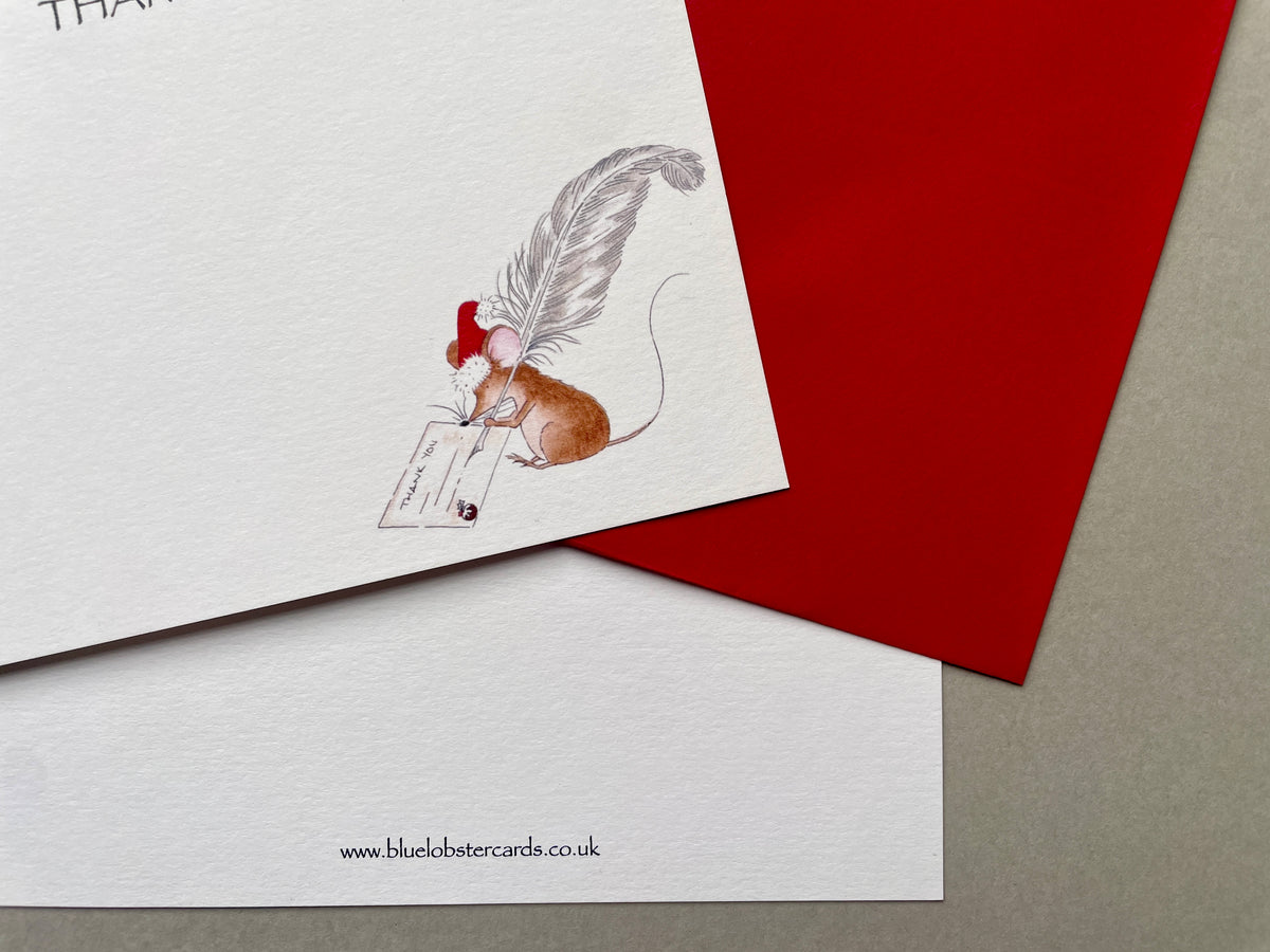 A6 size Christmas correspondence card with a mouse illustration and red envelope on a gray surface. Reverse of notecard with website printed in very small text at bottom of card