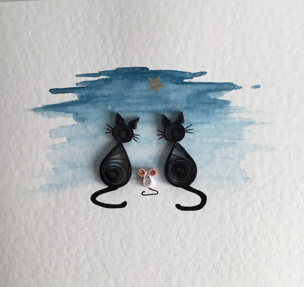 Close-up image of two quilled black cats with a white mouse at twilight. Hand painted and quilled with paper coils for a 3D effect in the UK using 300gsm hammered card