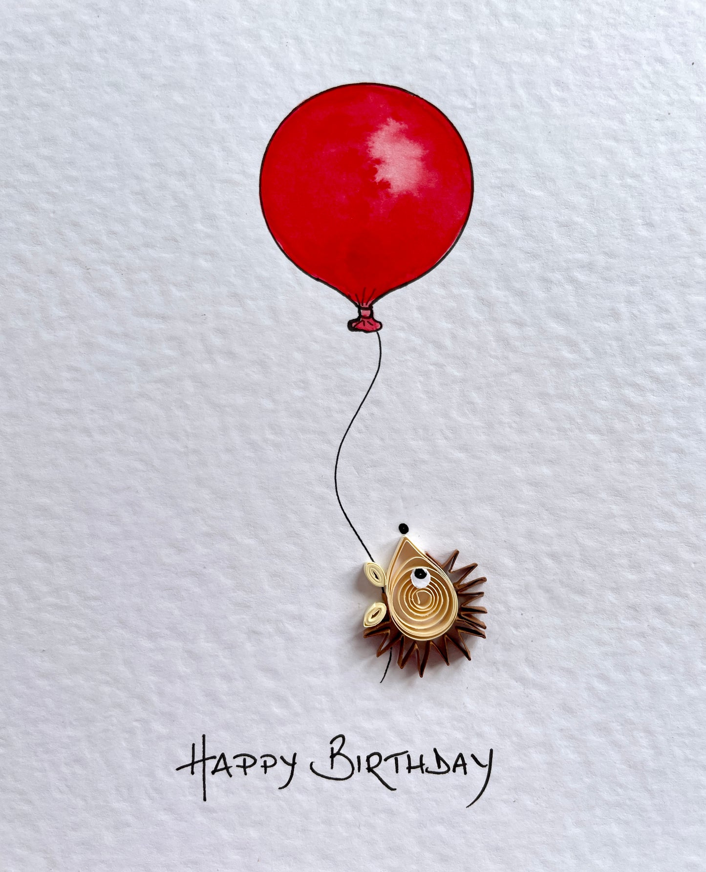 Hand painted red balloon with a 3D hedgehog on a textured white background, accompanied by 'Happy Birthday' text.