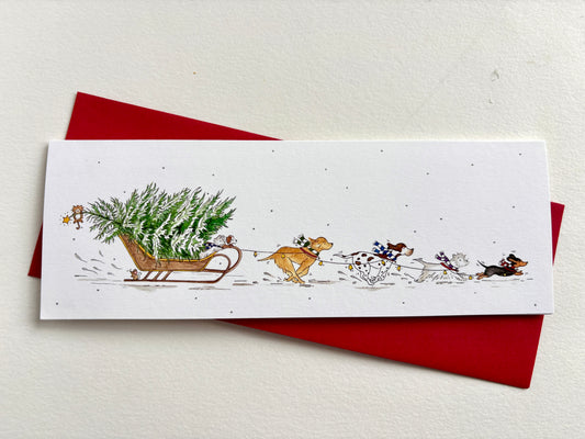 Dog Sleigh charity Christmas card shown with its coordinating envelope and original watercolour artwork