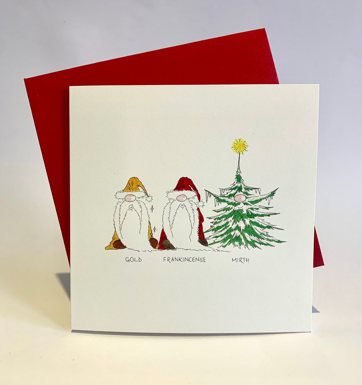 Christmas card featuring three gonks representing a funny take of the three kings above the words “Gold, Frankincense, Mirth”, with a red envelope
