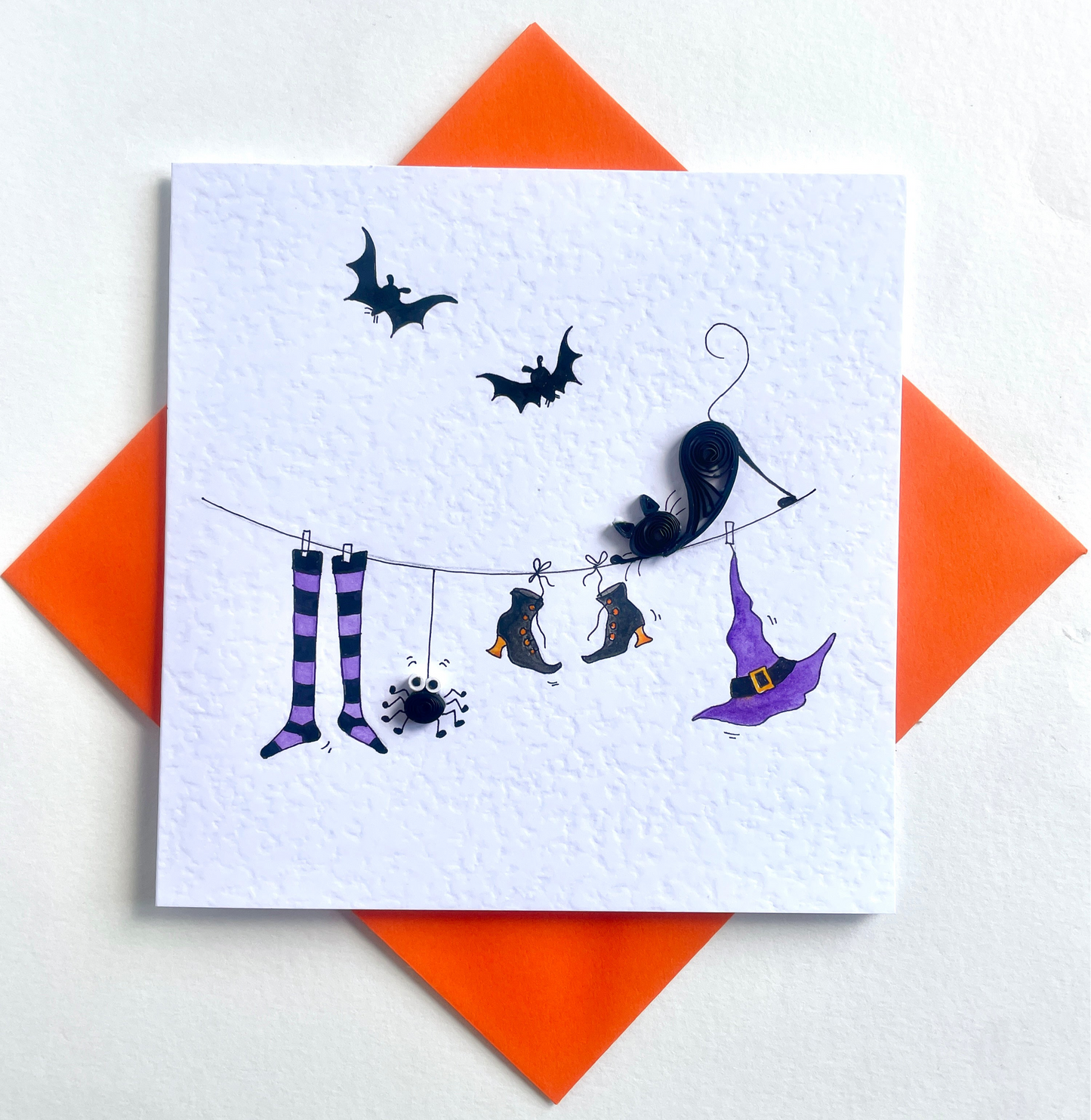 3D Halloween-themed card with quilled black cat and spider, hand-painted witch hat, and boots on a white background with orange envelope.