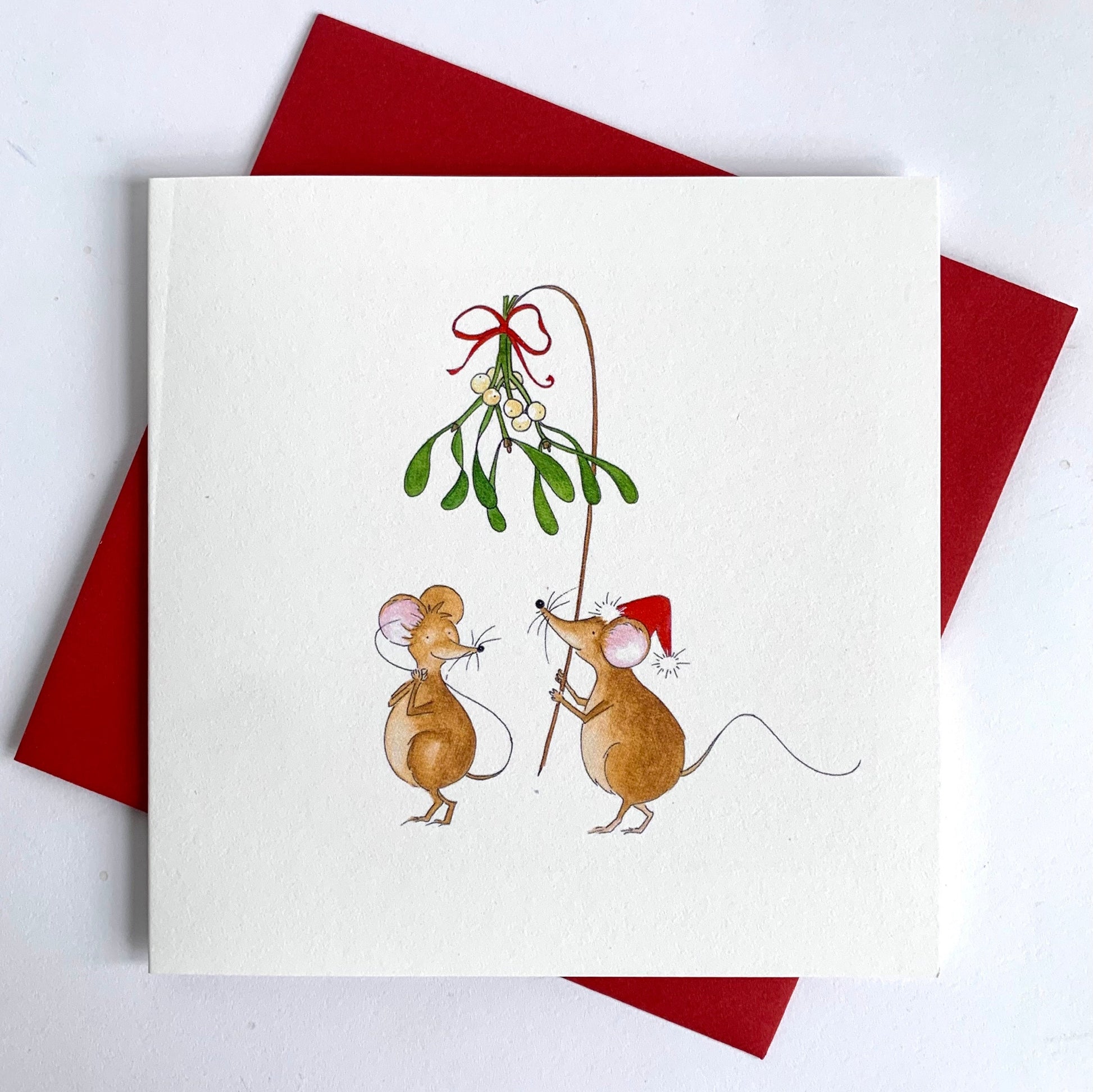 Close-up image shows softly textured matt uncoated cardstock, quality red envelope and print detail.