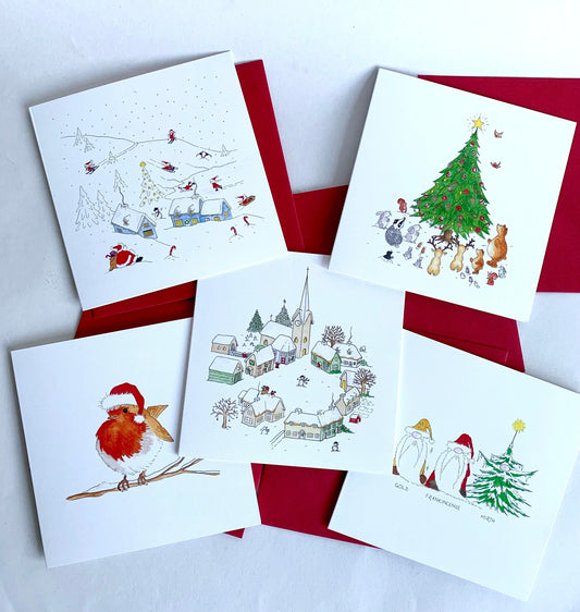 A set of five assorted Christmas cards with watercolour illustrations, with red envelopes, featuring a robin, skiing Santas, a snowy village, Christmas gonks and woodland animals.