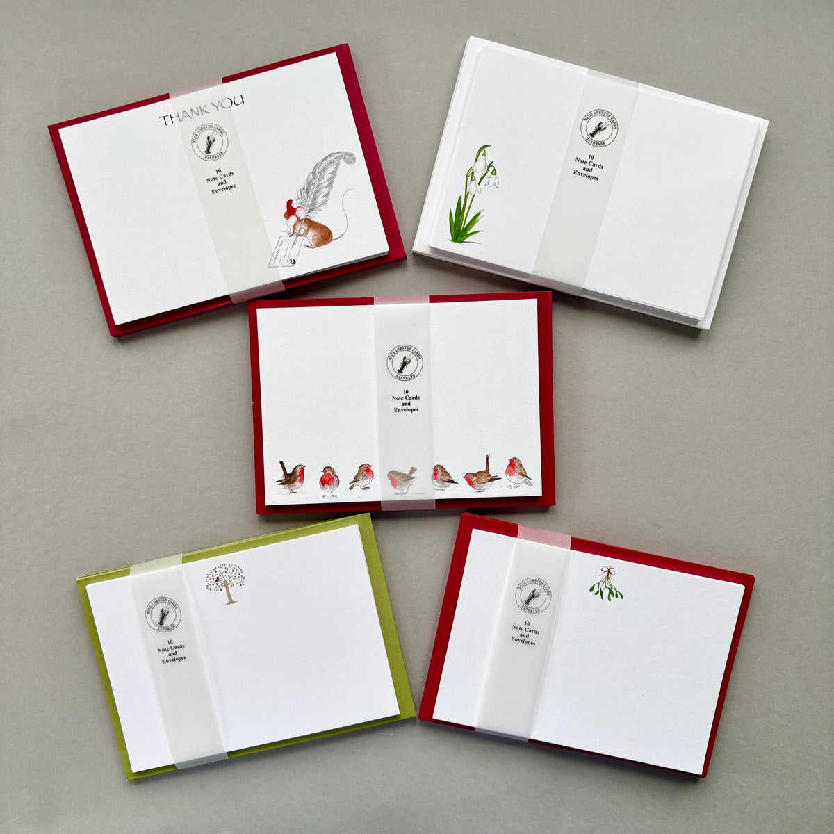 Five Christmas stationery sets with coordinating envelopes from Blue Lobster Cards - ideal for a stocking filler or small gift, festive invitations and thank you notes. Attractively packaged in a recycleable belly band. 