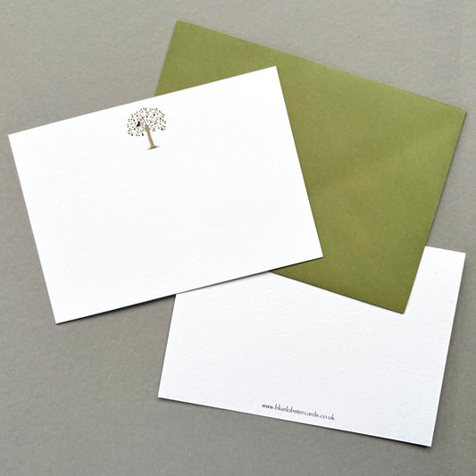 Showing front and reverse of Partridge cards with matching olive green envelope arranged on a grey surface - from own original watercolour.