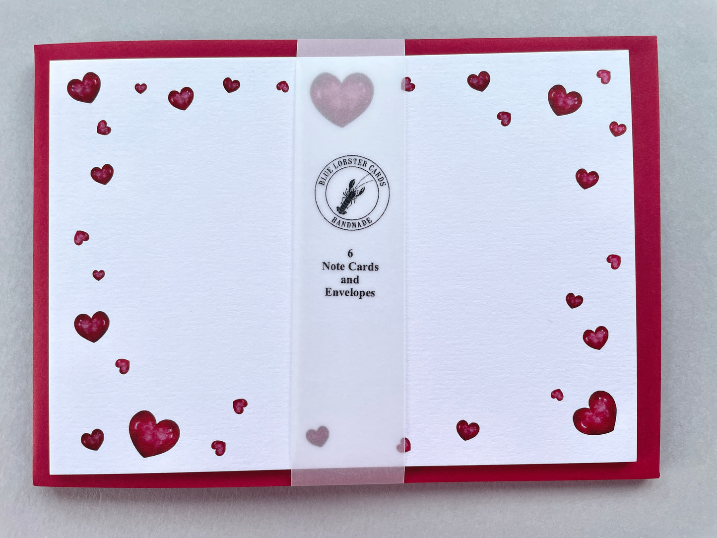 Set of 6 heart-themed note cards with envelopes on a gray background