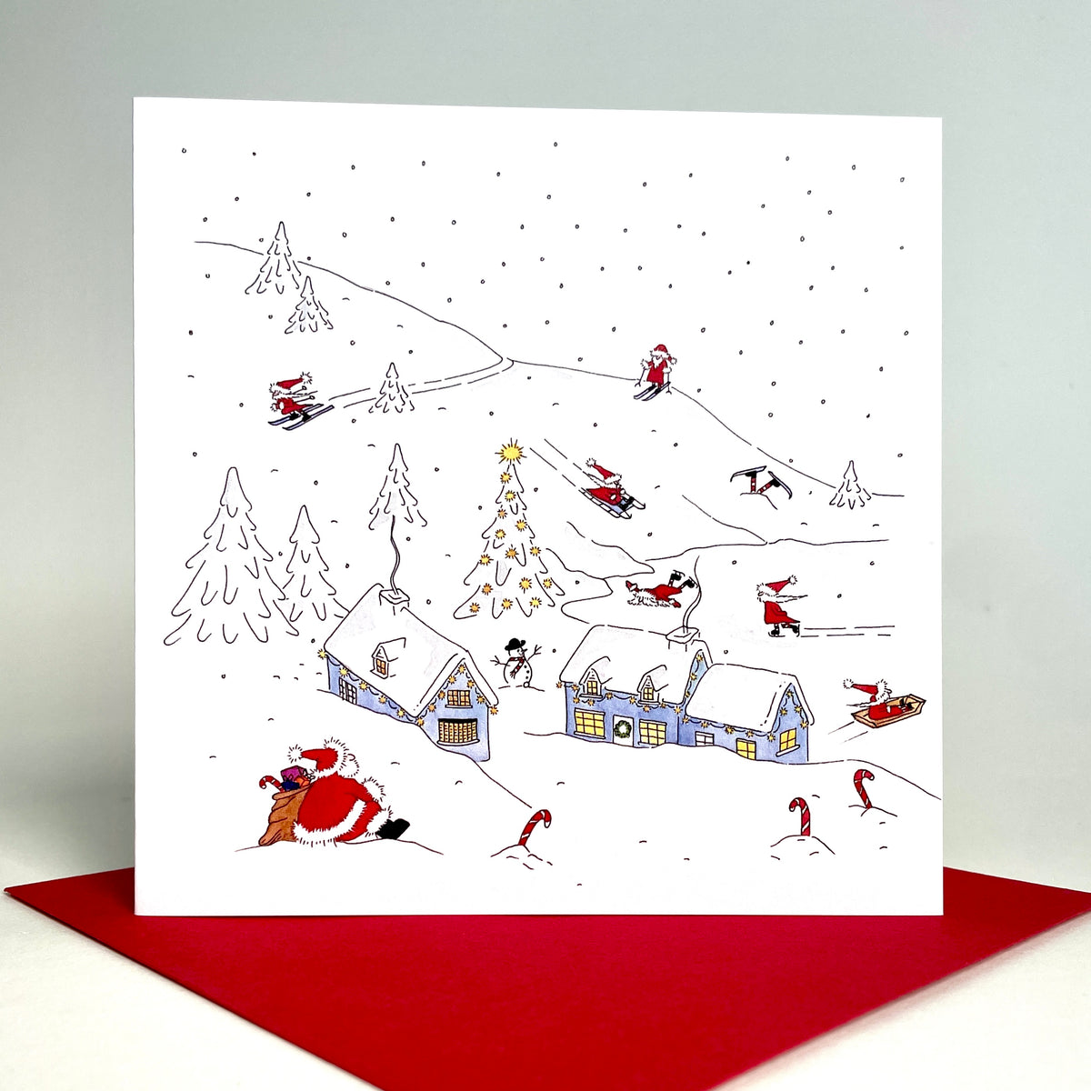 Fun and festive square christmas card featuring Father Christmas and his elves enjoy a well-earned break, in a lively winter snow scene