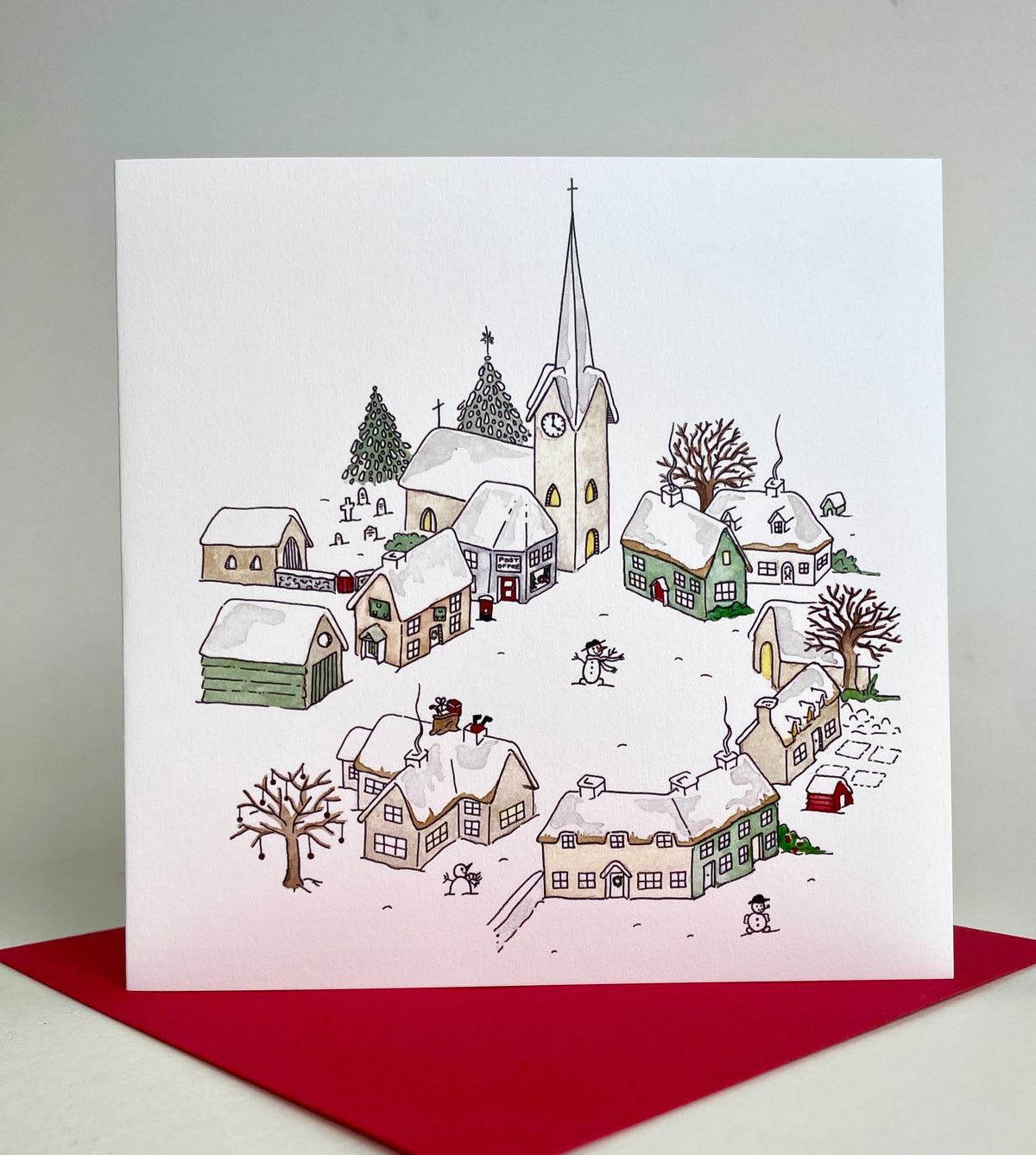 Winter village snow scene printed in the UK using fine-quality cardstock, supplied with coordinating red envelopes
