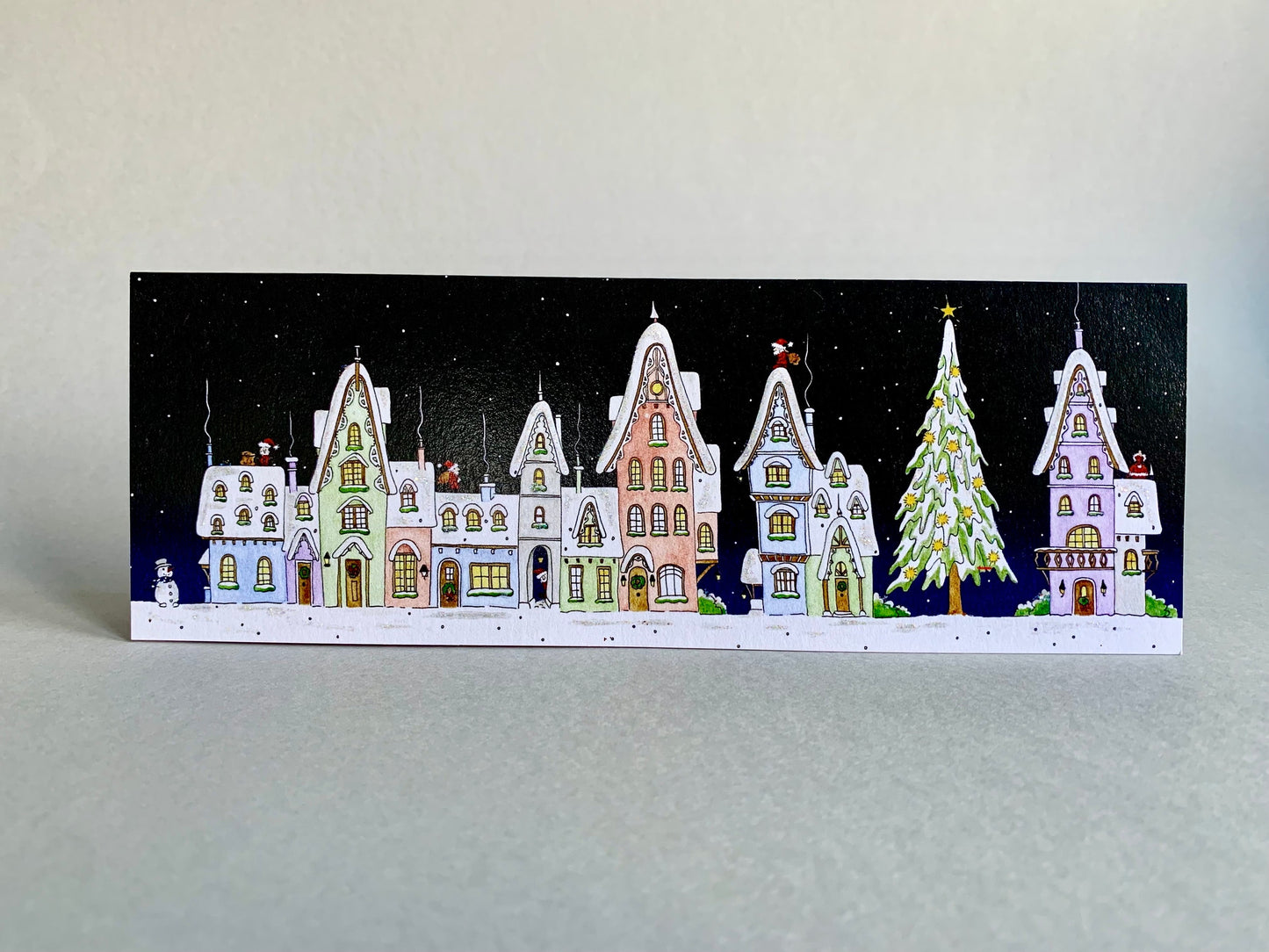 Snowy Houses on Christmas Night
