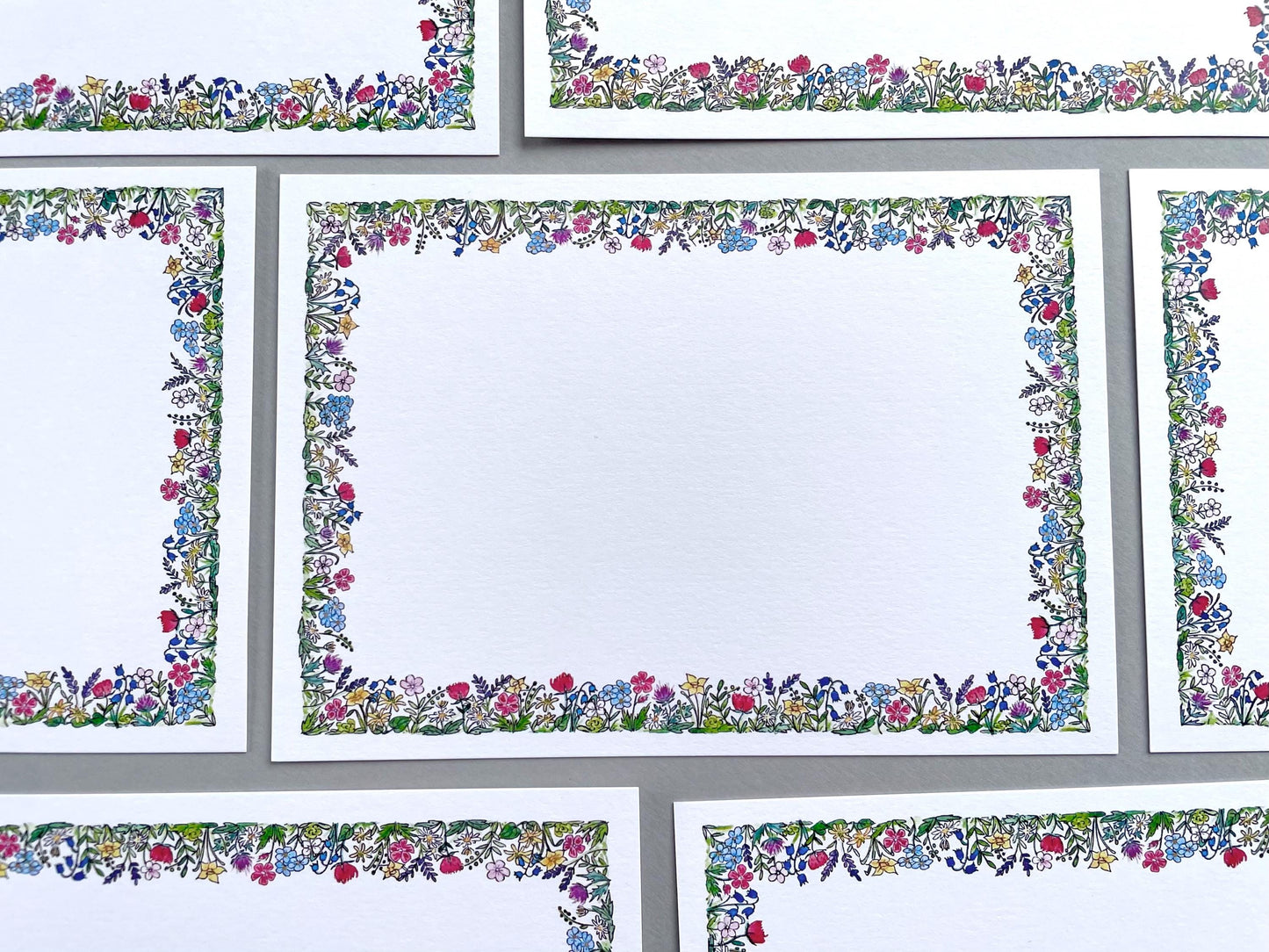     Pack of blank watercolour flower note cards with assorted coloured envelopes